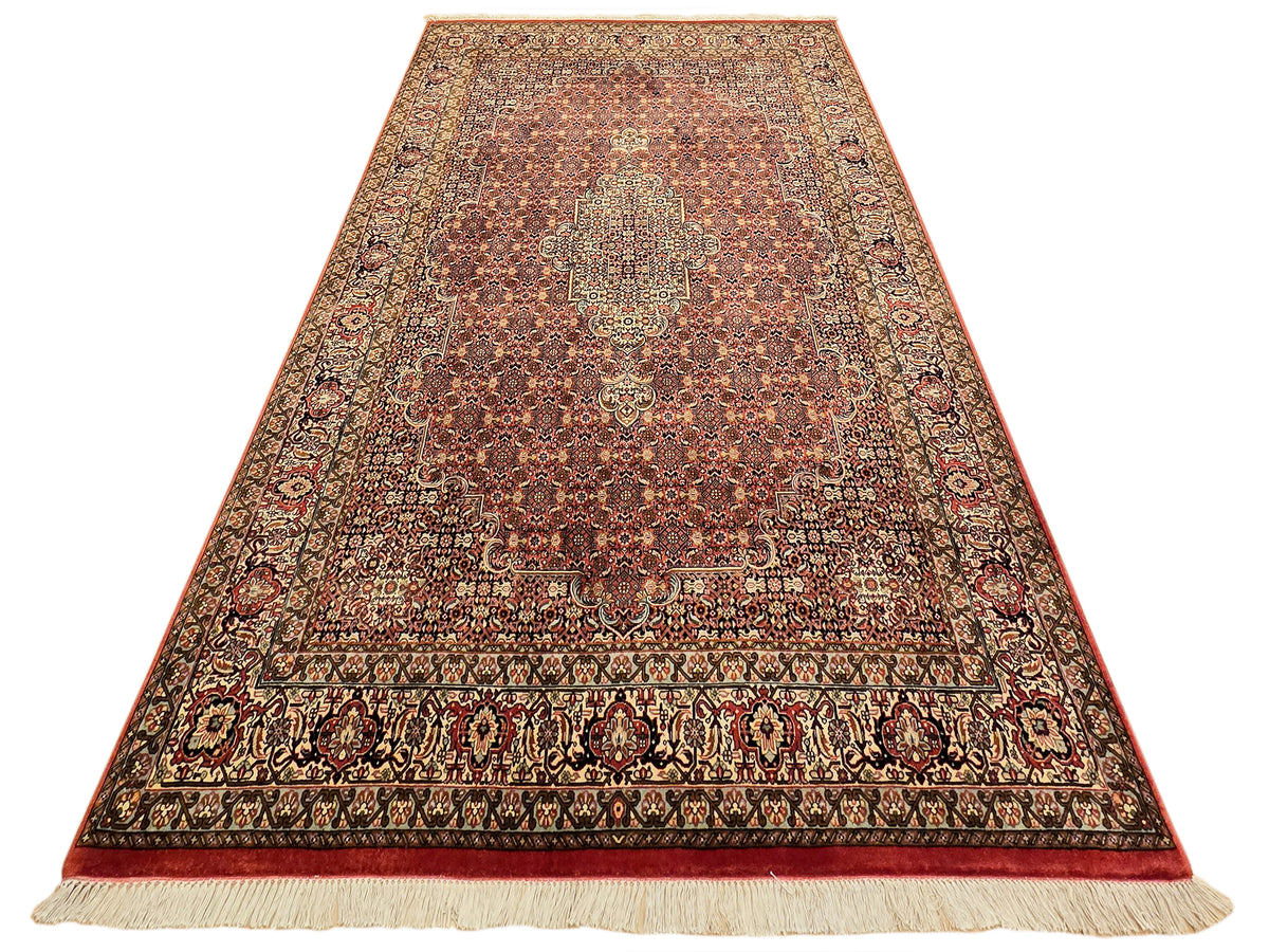 Bidjar rug with distressed rust and cream micro-pattern, central medallion, and border.