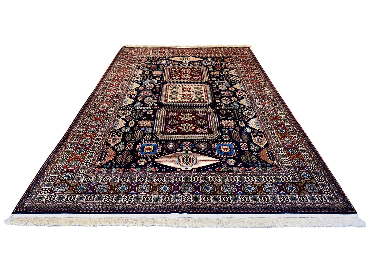Azerbaijan rug, dark navy and red medallion design, flat woven with cream fringe