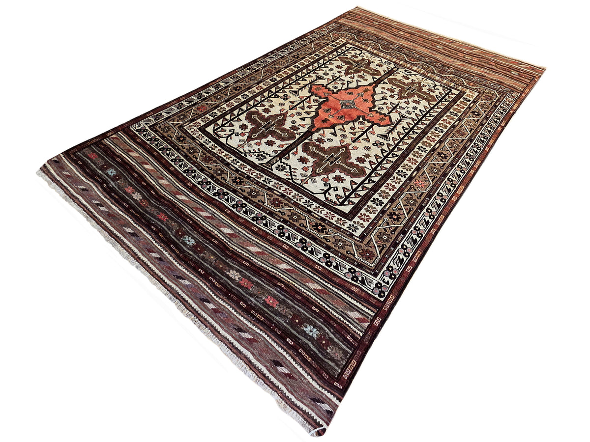 Soumak rug diagonal view with red motif, cream field, and dark brown geometric stripes