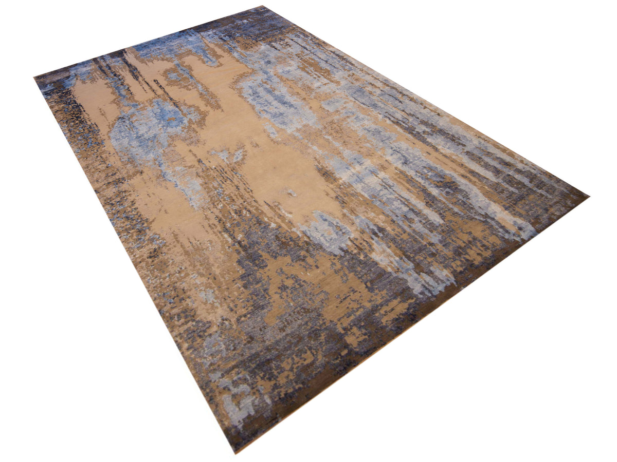Modern Tibetan rug with beige base and blue distressed striped pattern, diagonal view