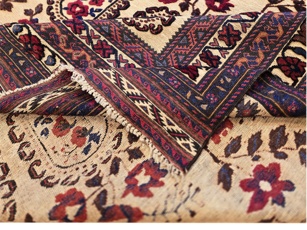 Close-up of rug texture and pattern with cream pile and navy geometric lines.