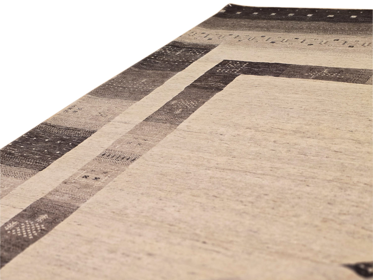 Rectangular rug corner view with beige field and dark brown striped border