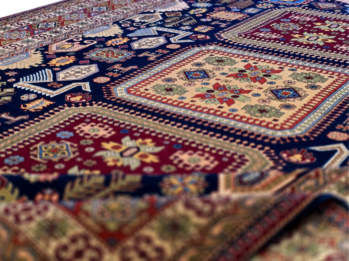 Geometric patterned Azerbaijan rug close-up with blue, red, and cream details