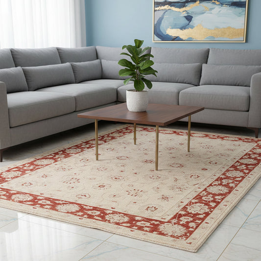 Ziegler Afghan rug with cream base and red ornamental border pattern