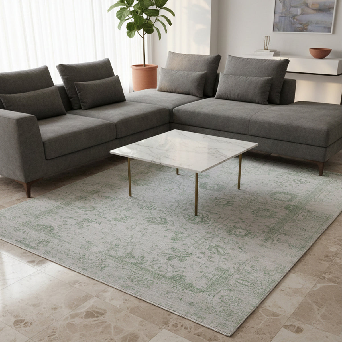 Light gray area rug with green ornamental pattern, shown on the floor