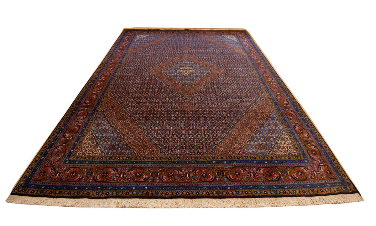 Persian-style area rug with dark red geometric pattern, blue border, and central diamond motif