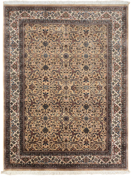 Khashan rug with cream field, blue motifs, and decorative border