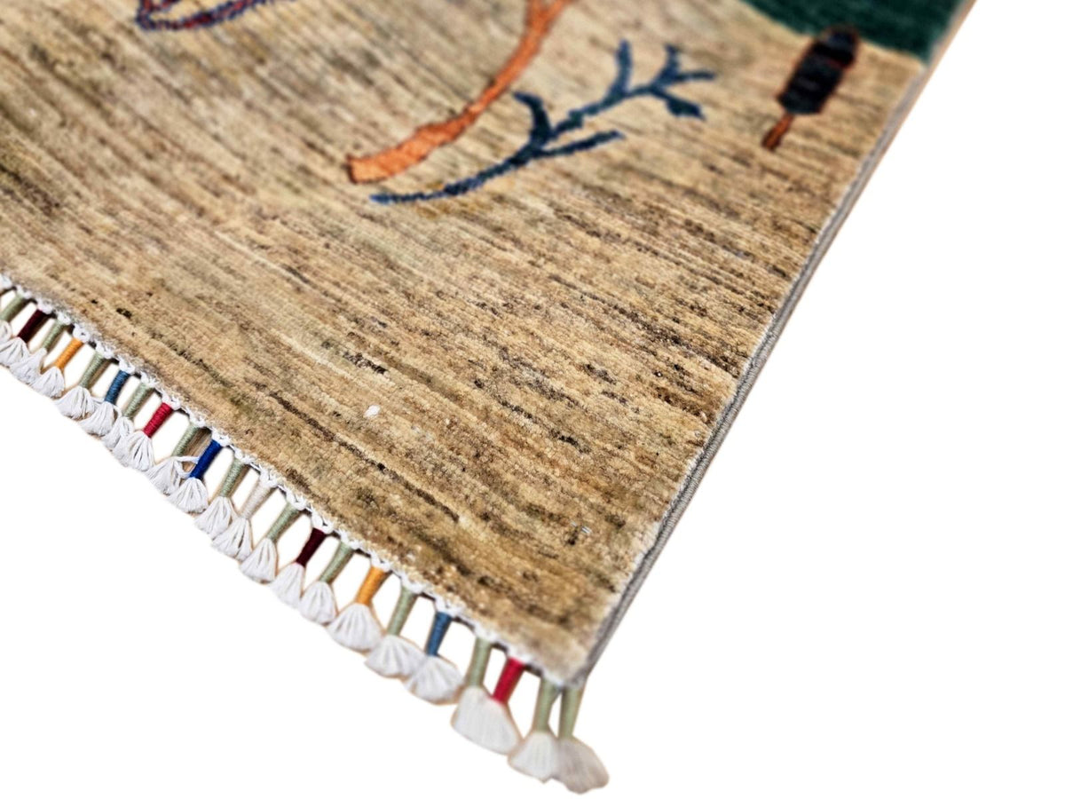Ariana Gabbeh rug corner with white fringe trim and tan woven texture