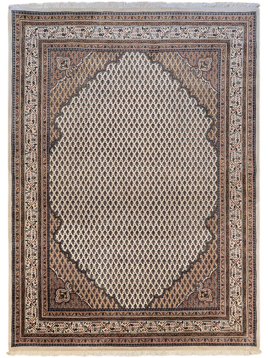 Geometric ornamental area rug with dark brown center, ivory lattice, and patterned border