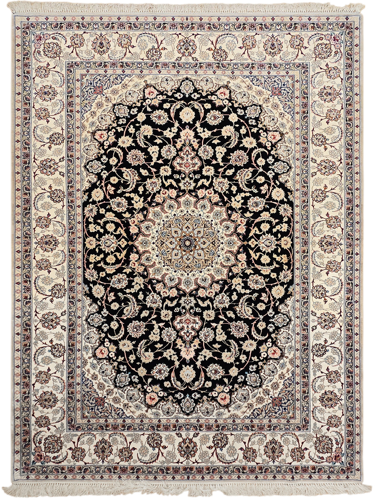 Isfahan rug front view: black floral medallion on cream with detailed blue border and fringe