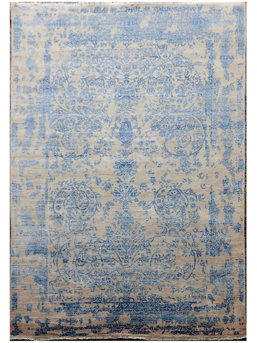 Modern area rug with blue ornamental pattern on light beige background, rectangular.