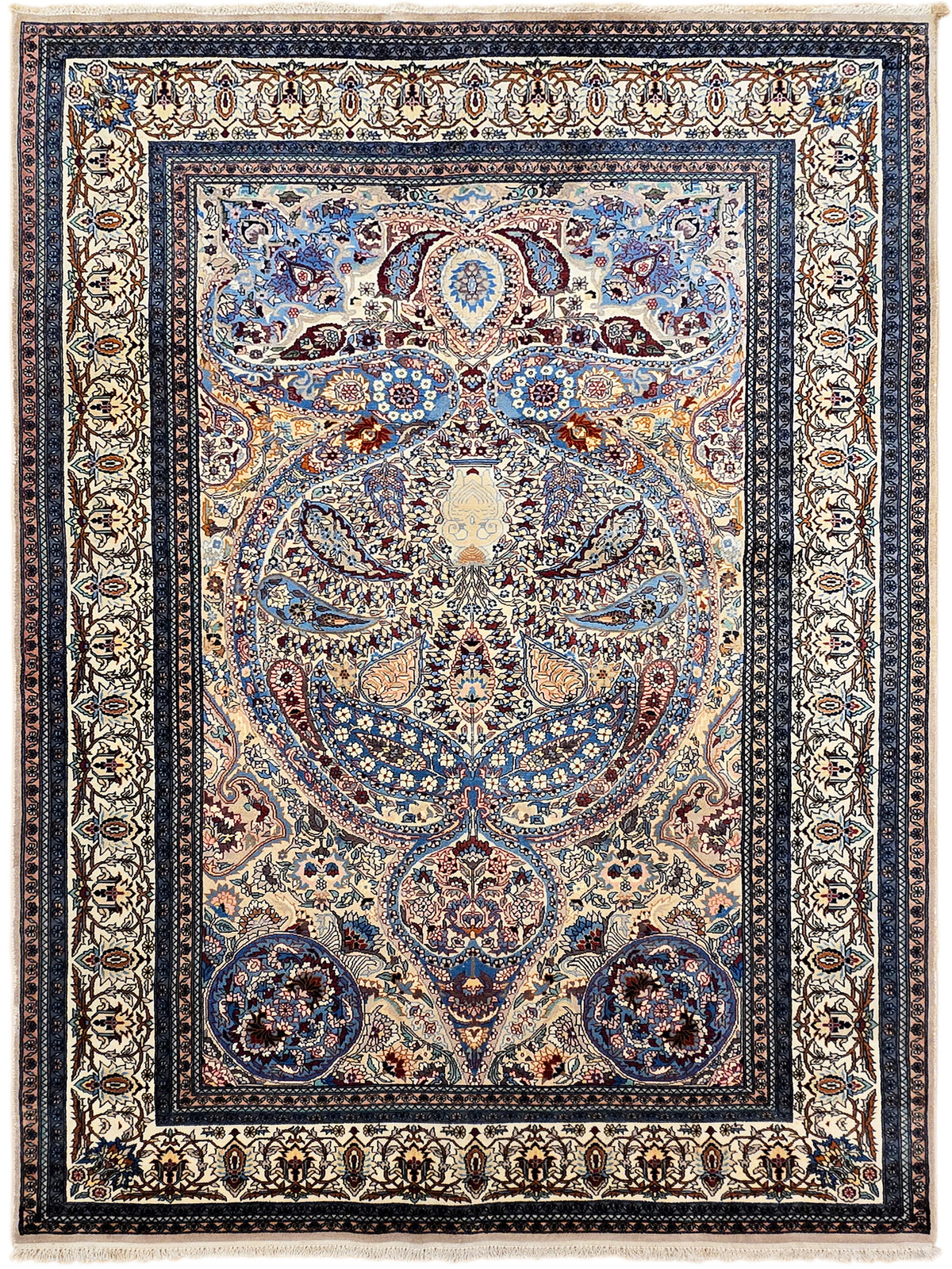 Blue and beige Tabriz-style rug with central medallion, detailed rosette border, fringed edges.