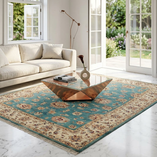 Turquoise patterned rug with ornate cream border and fringed perimeter