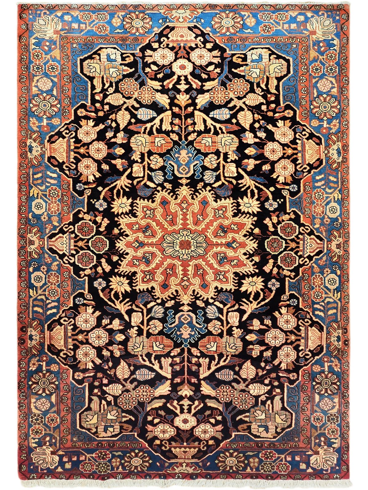 Nahawaand rug with symmetrical floral and vine pattern, dark center and blue border, fringed edges.