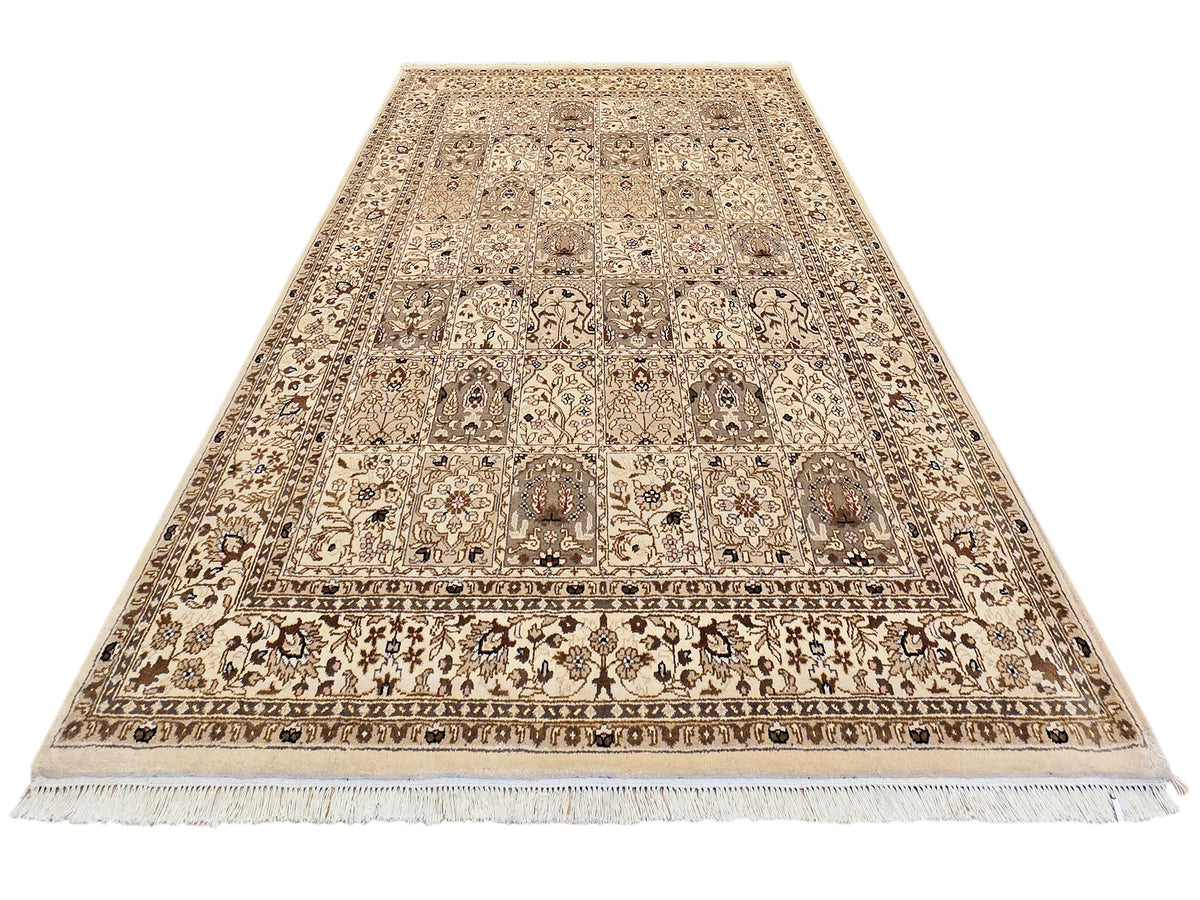 Bakhtiar rug, beige and brown ornamental pattern with central band and fringed ends.