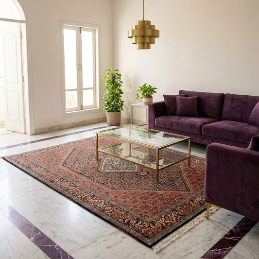 Rust and black patterned area rug featuring central medallion, shown laid on the floor.