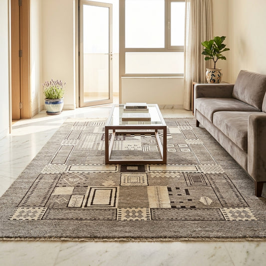 Geometric patchwork area rug in gray and beige with small square motifs