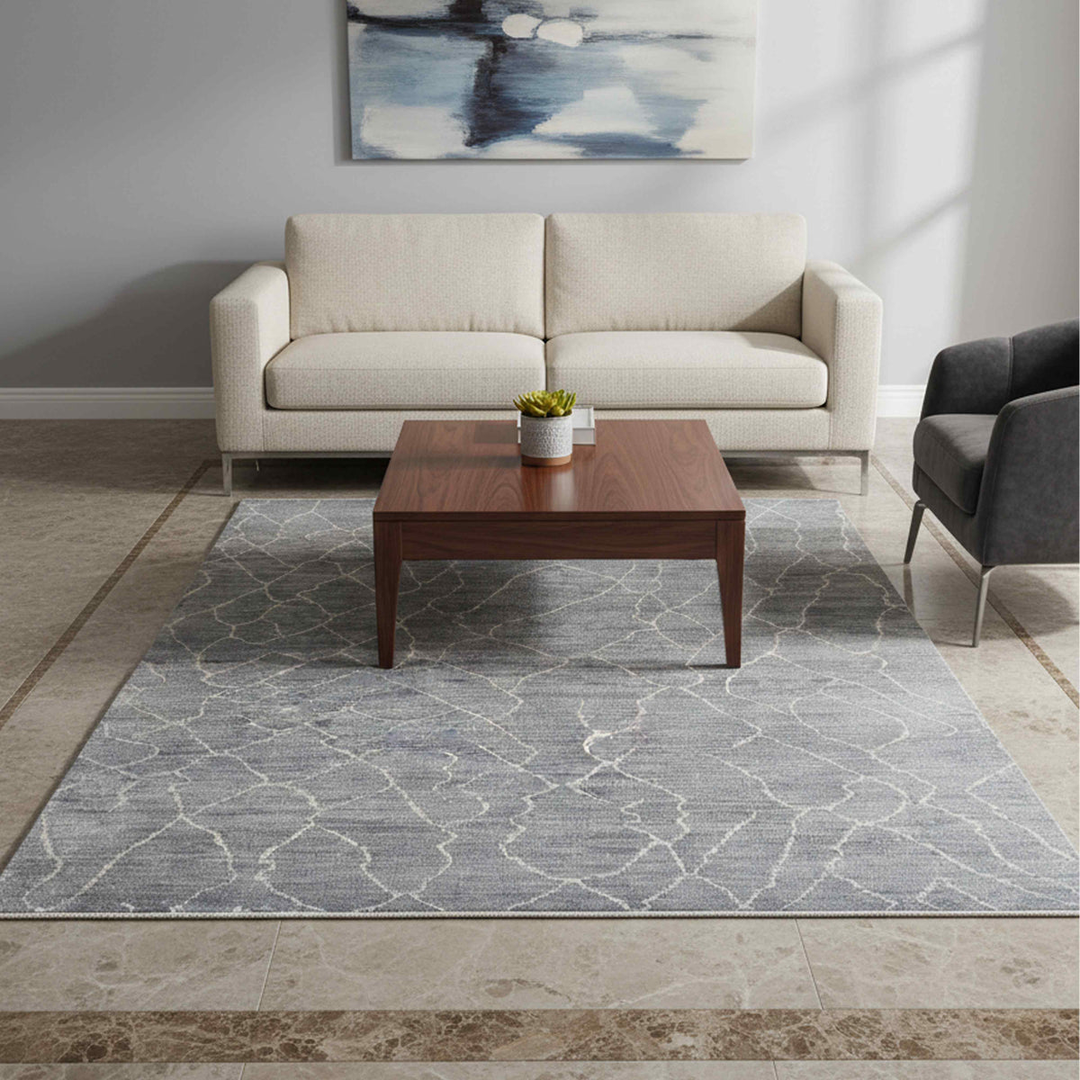 Grey area rug with crackled geometric pattern, beige lines, and fringed border.