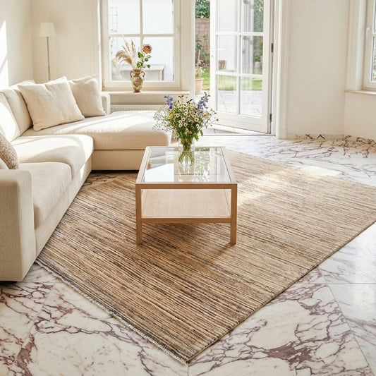 Beige and brown striped Ziegler rug with short textured pile, laid flat on floor