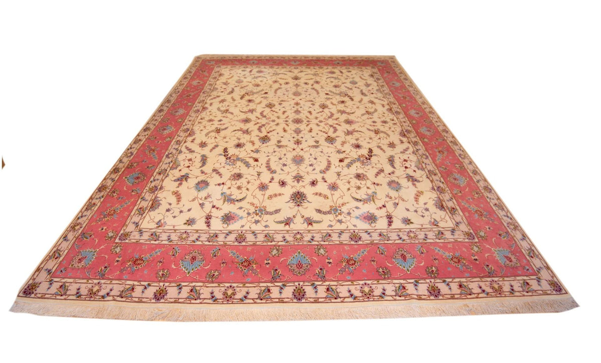 Large rectangular rug with cream center and red border, Tabriz-style floral pattern