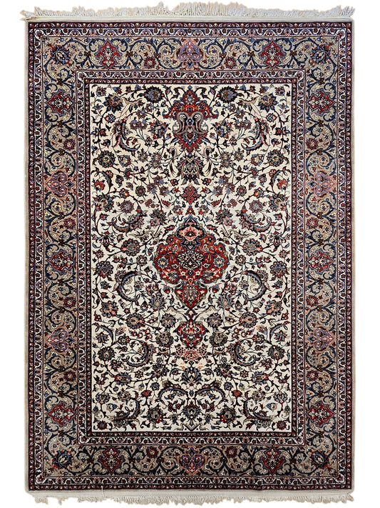Esfahan perizisch rug full view with cream field, navy border, red medallion, and fringed edge