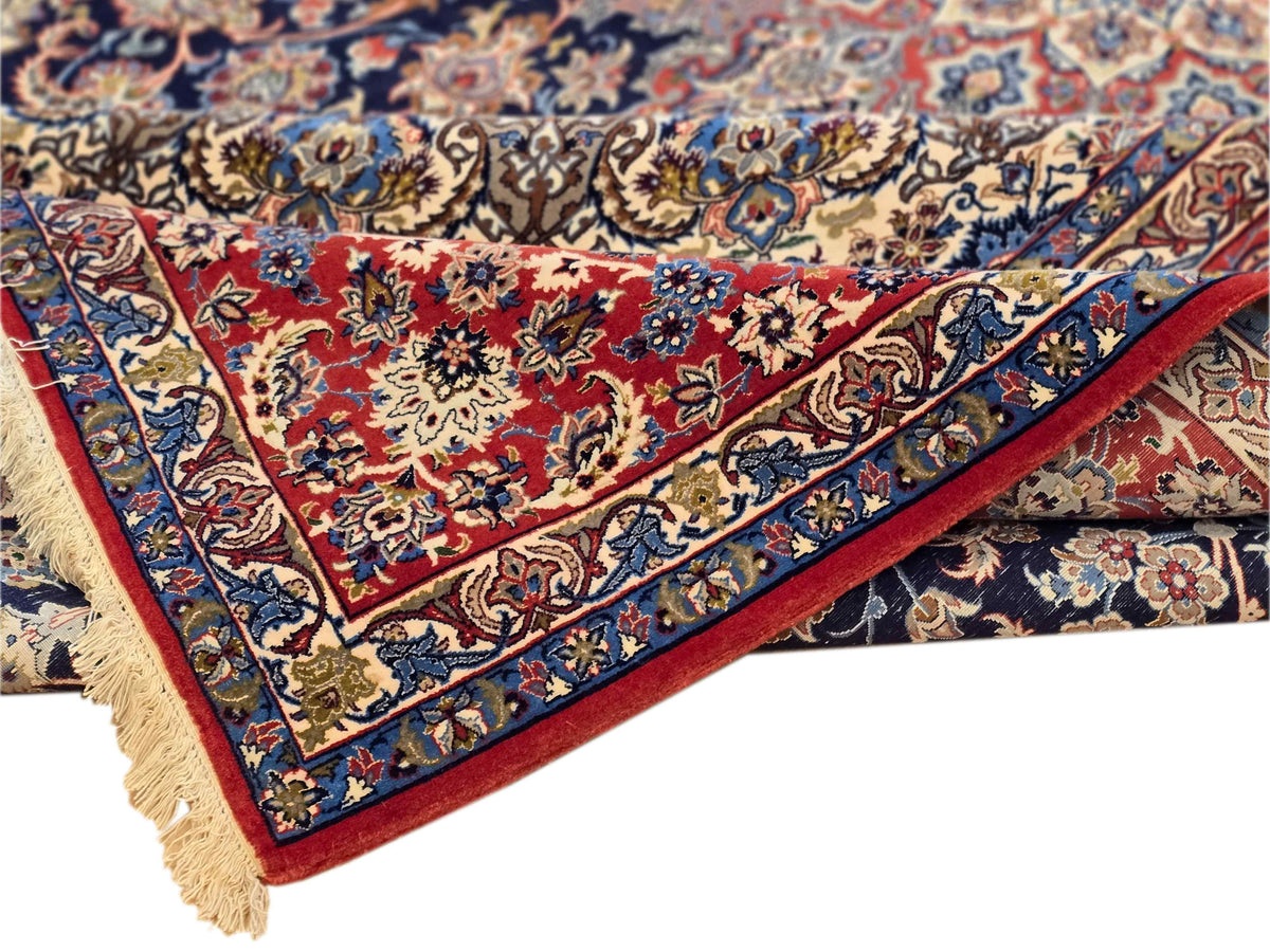 Persian-style rug edge with fringe, red-and-blue floral motifs and ornate border