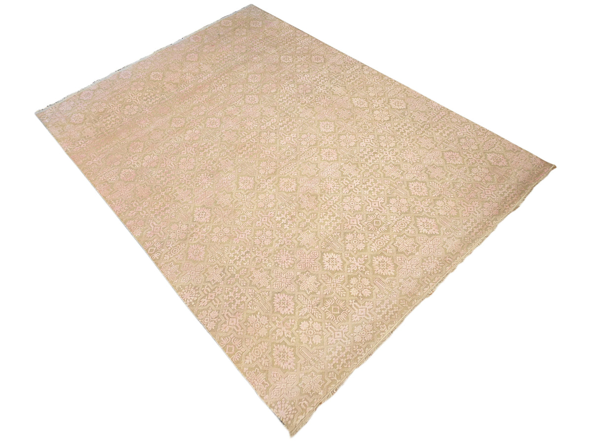 Beige area rug with soft pink and cream geometric floral medallion pattern, diamond view