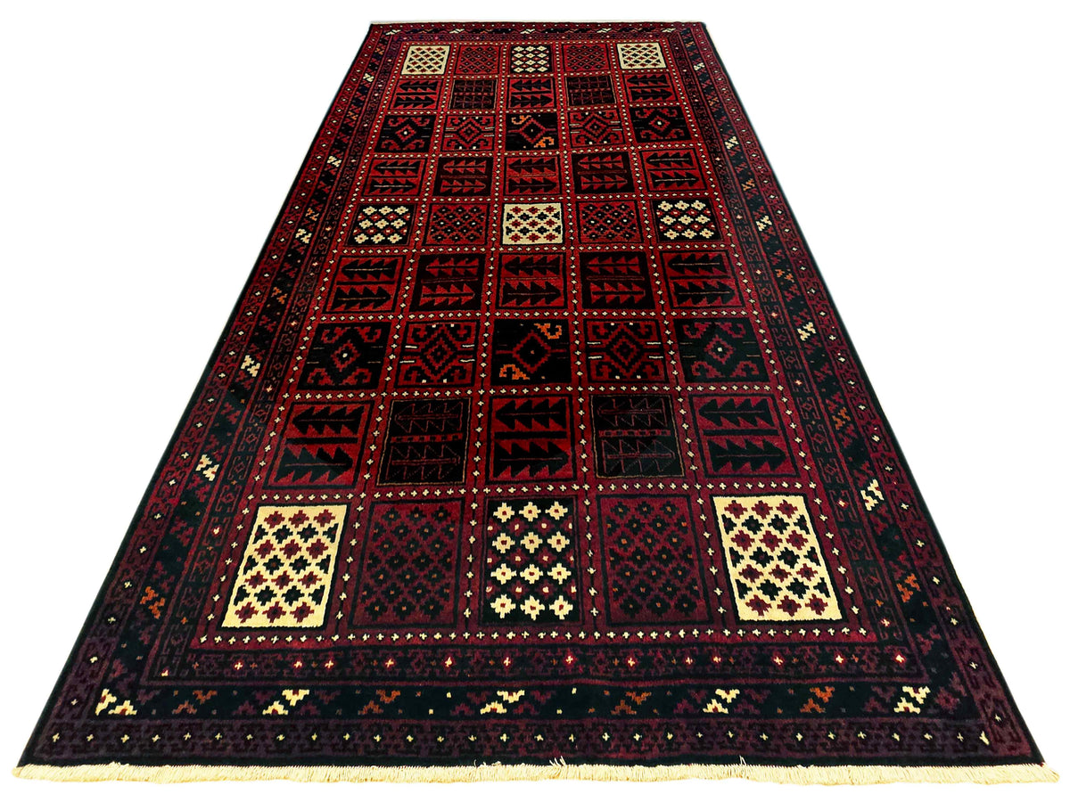 Persian-style rug with dark red central panel, cream squares, and navy geometric trim.