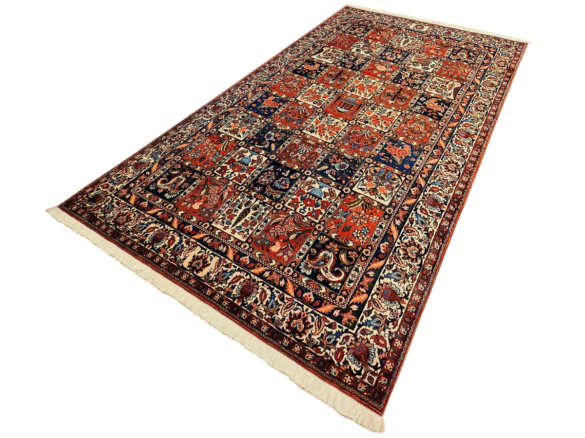 Bakhtiare 300x210 rug laid flat with rich red, navy, and cream patterned field