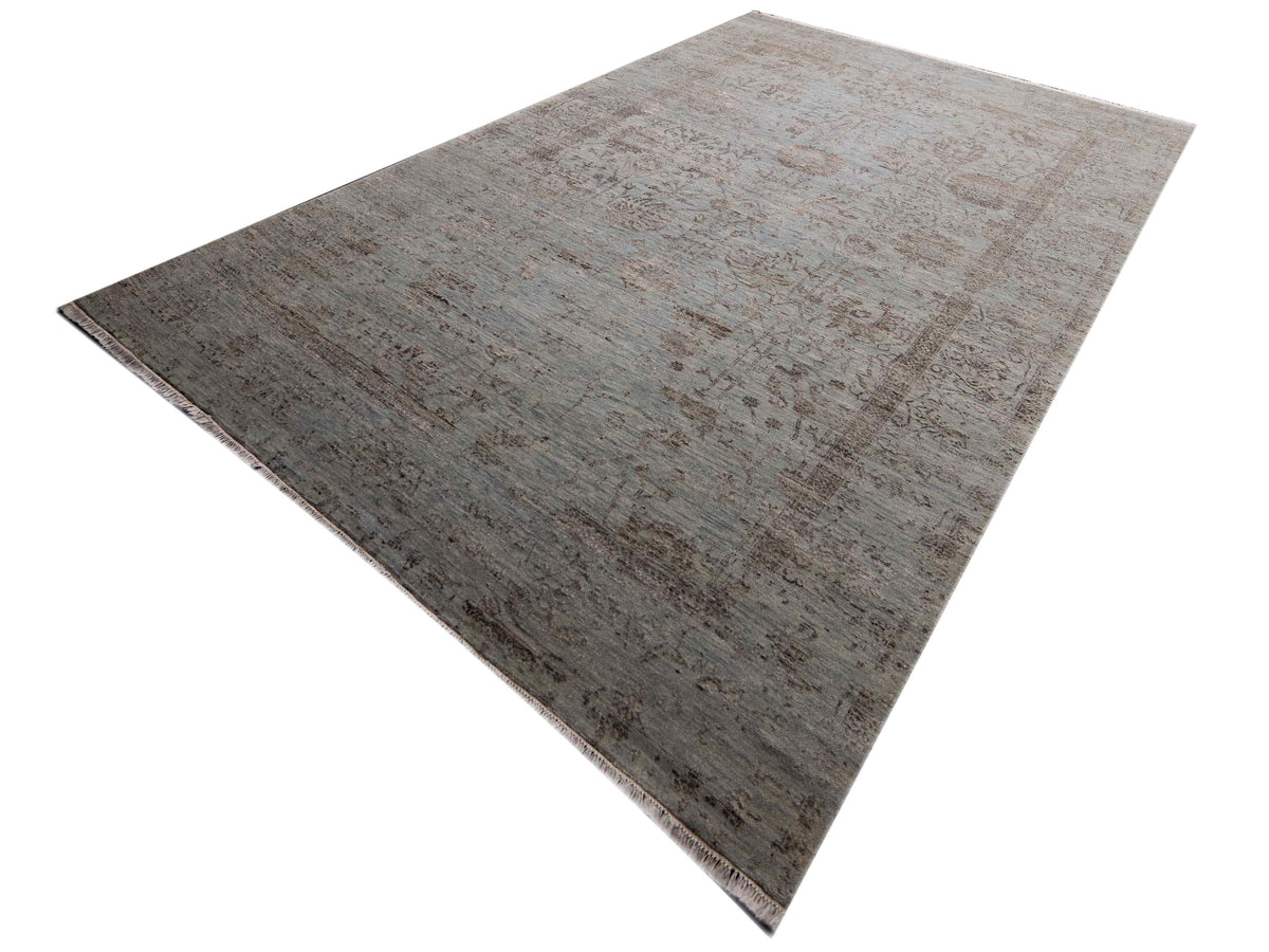 Light gray distressed rectangular rug with short fringes and worn abstract print