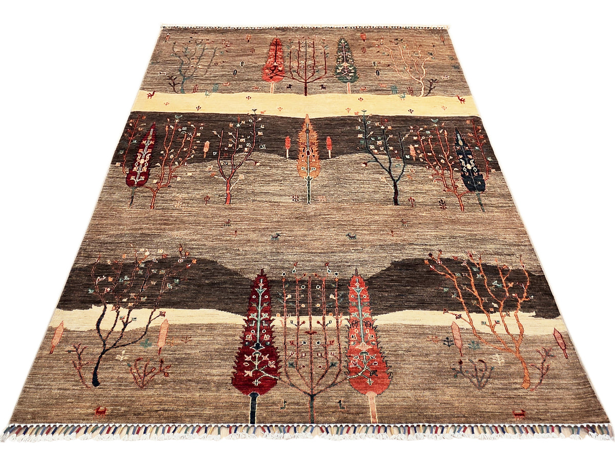 Patterned area rug with central medallion-like tree, brown/cream base, red accents, fringe border