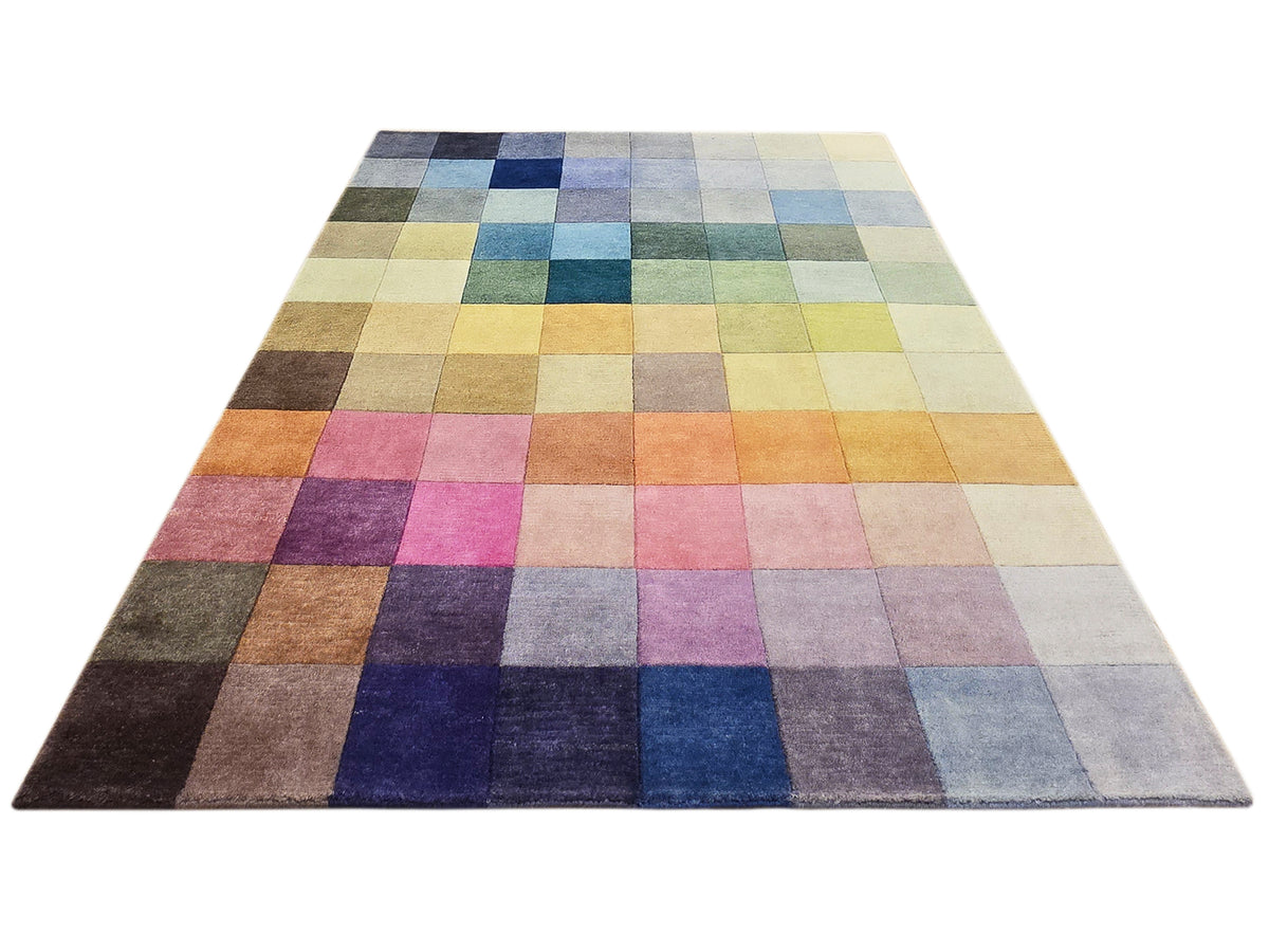 Multicolor checkered area rug with varied squares in blue, green, purple, and beige