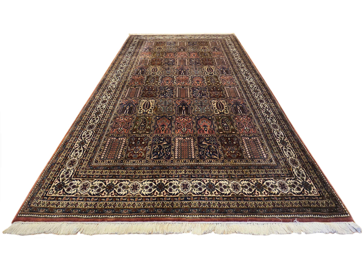 Triangular view of multicolor Qum-style rug with ornate central medallion and fringe