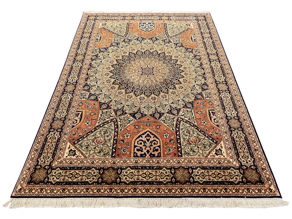 Multicolor rug with central medallion and corner ornaments, cream fringe edges