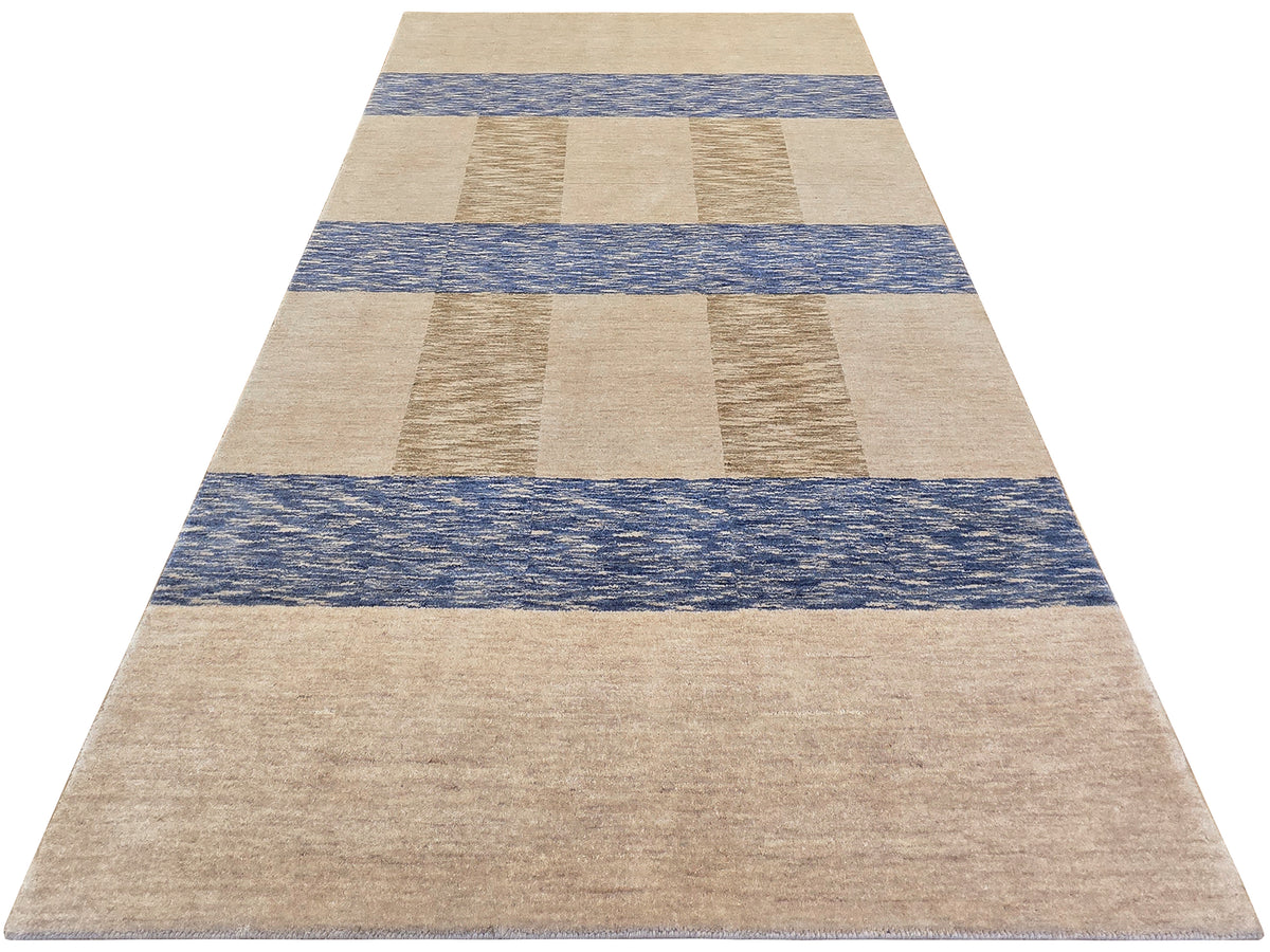 Rectangular handloom rug with beige base and blue stripe band pattern