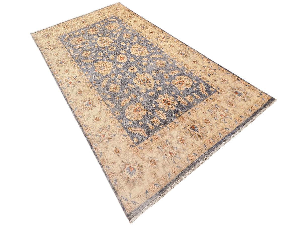 Beige and blue rectangular floral area rug with central medallion and decorative border
