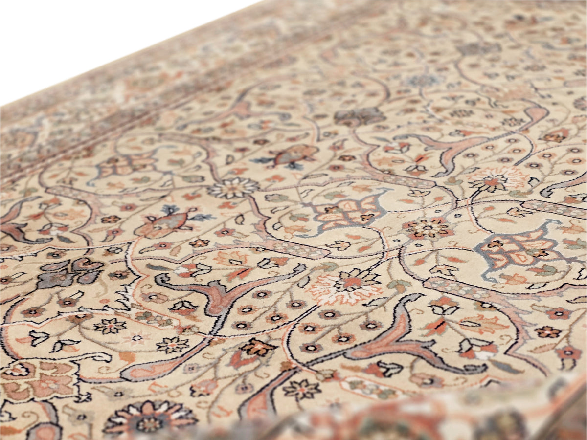 Khashan rug close-up with beige ground, floral ornaments, and subtle texture