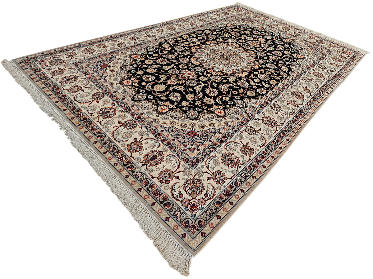 Isfahan rug top view: black floral medallion on beige-cream with ornate multicolor border