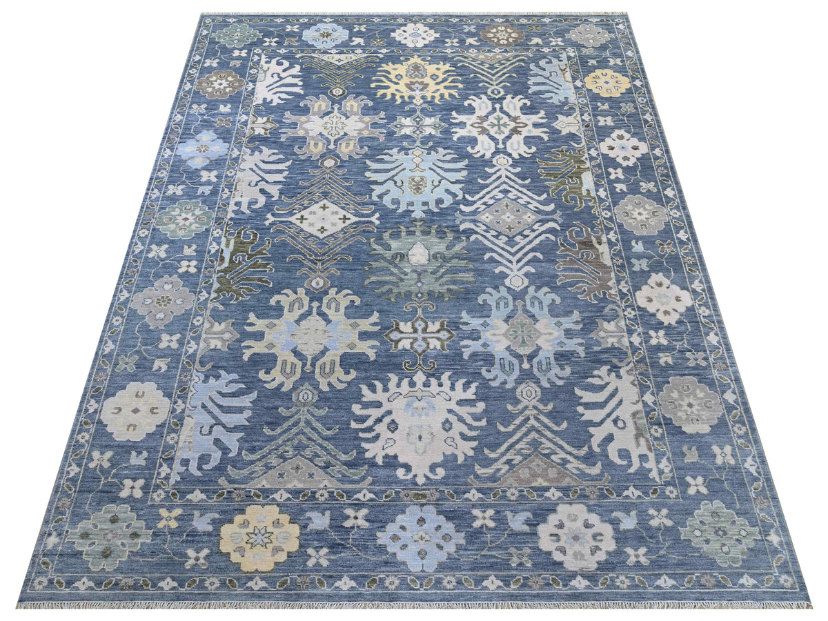 Oushak rug with blue and ivory floral geometric border, centered medallion pattern