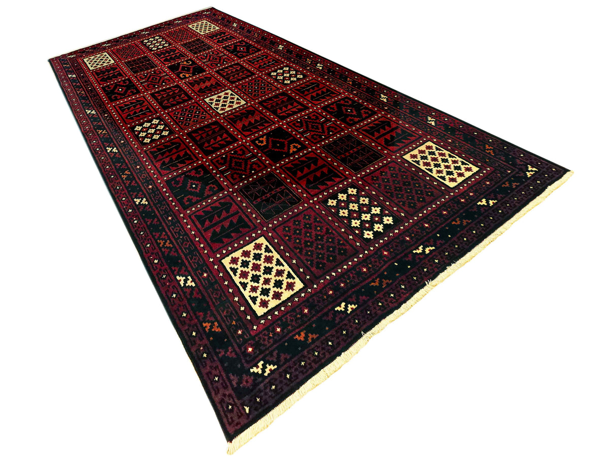 Persian-style rug with dark red pattern grid, cream medallion details, and navy border.