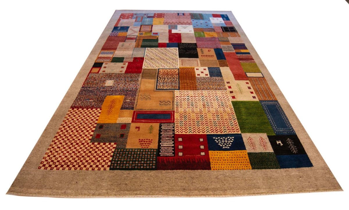Rectangular patchwork rug with multicolor squares and borders on tan background