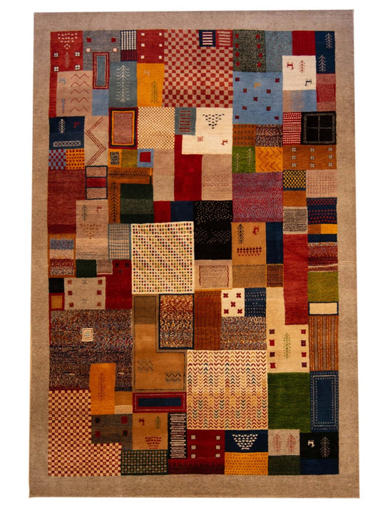 Patchwork area rug with red, blue, tan geometric blocks on beige ground