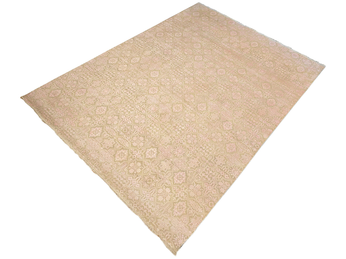 Beige area rug with light pink and cream medallion geometric floral design, diamond view