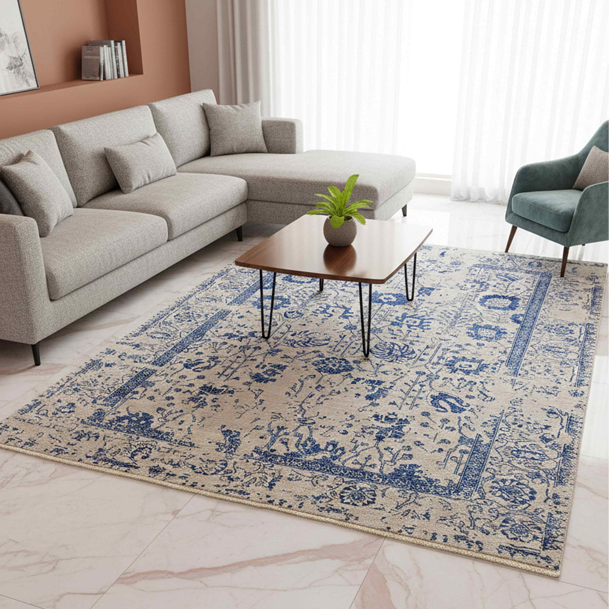 Blue and cream patterned area rug with border and short fringes on floor