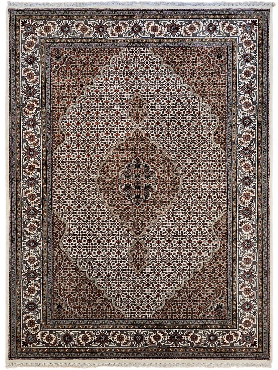 Square oriental rug with central diamond floral medallion, brown, cream, and dark trim