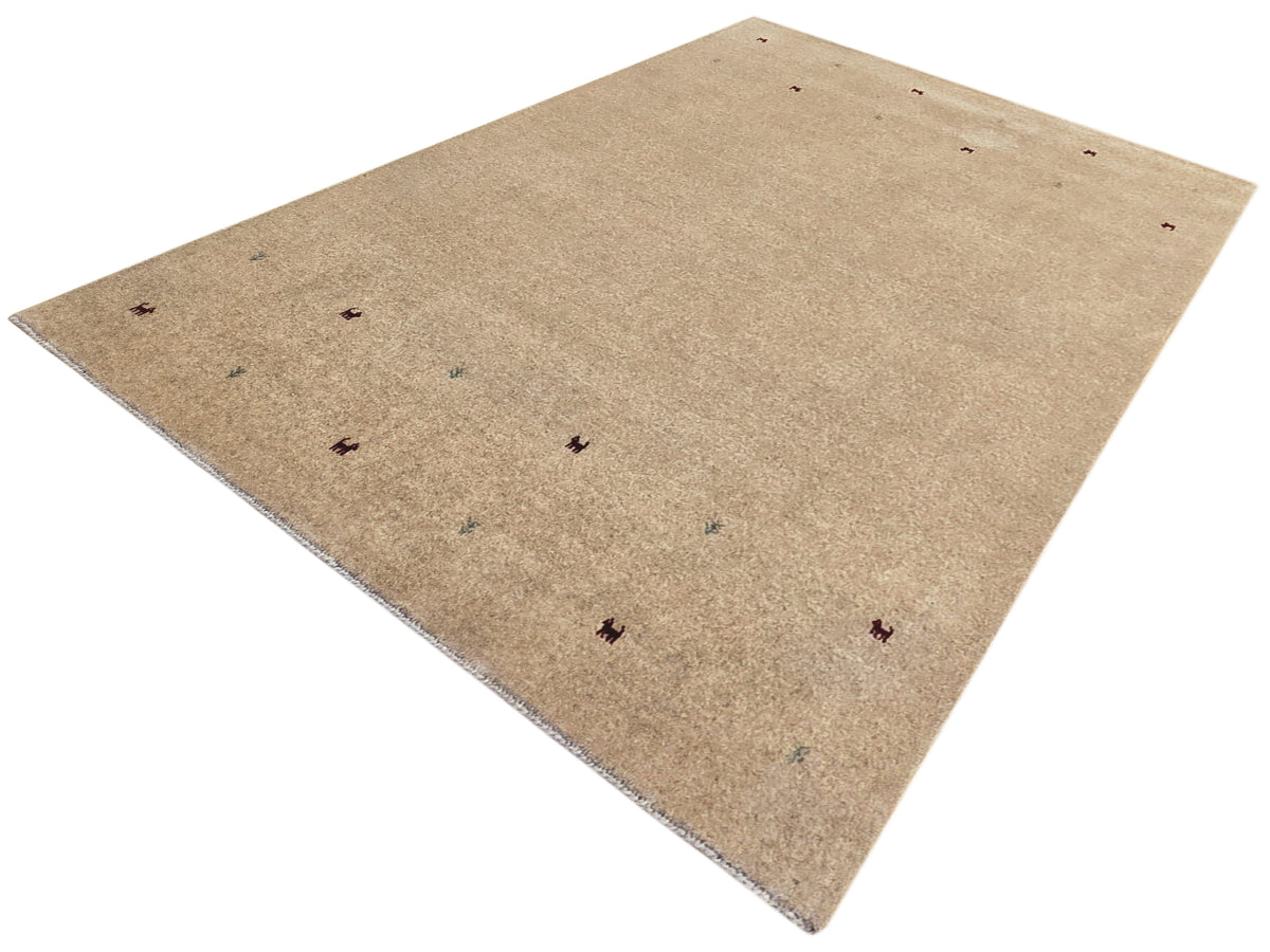 Beige handloom rug with small multicolor motifs, angled view, flatwoven texture