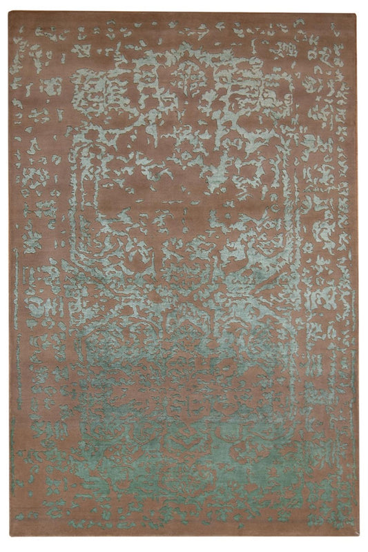 Distressed rectangular area rug in teal and brown, rustic style