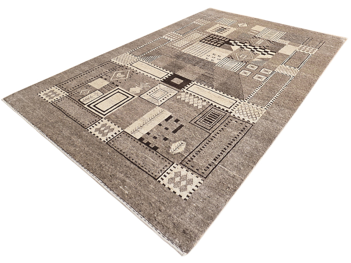 Geometric patchwork rug in beige, gray, and dark accents, 242x168 cm