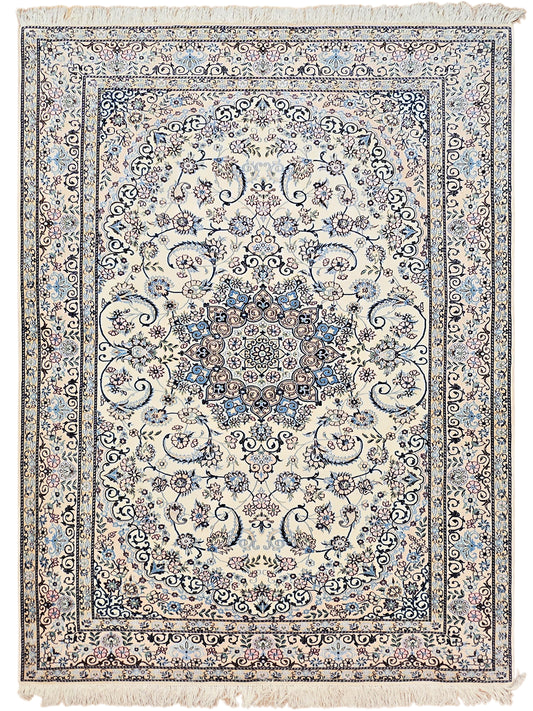 Cream area rug with blue floral medallion and ornate border, square corner fringe