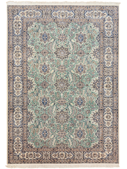 Nain rug front view with teal floral repeat pattern and navy decorative frame border